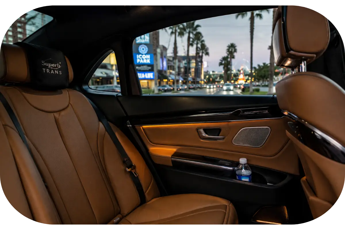Luxury sedan interior for premium chauffeur service Orlando FL with leather seats and Orlando International Drive view